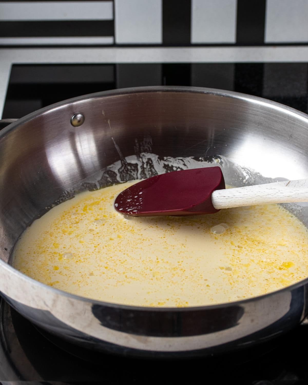 Cream added to the pan and brought to a gentle simmer