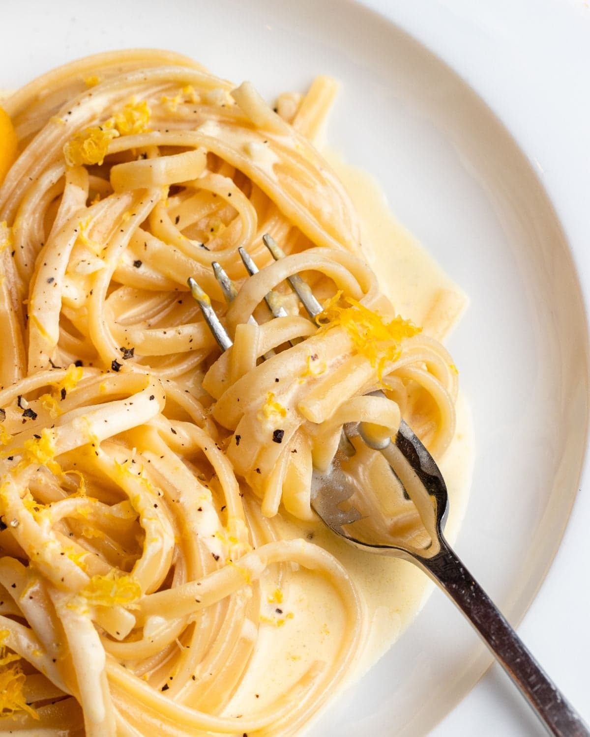Creamy lemon pasta served with parmesan and lemon zest
