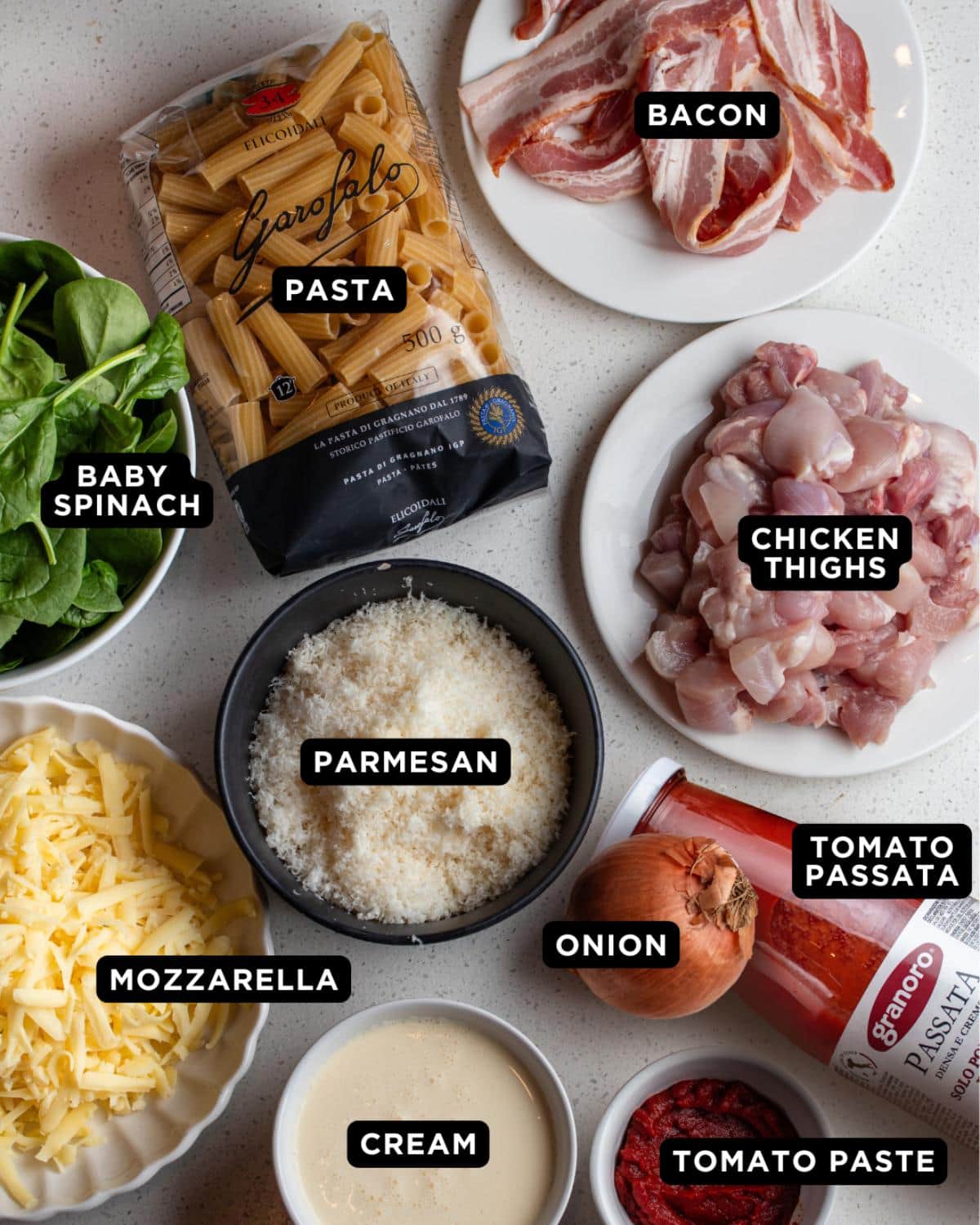 Ingredients laid out on a white bench top.