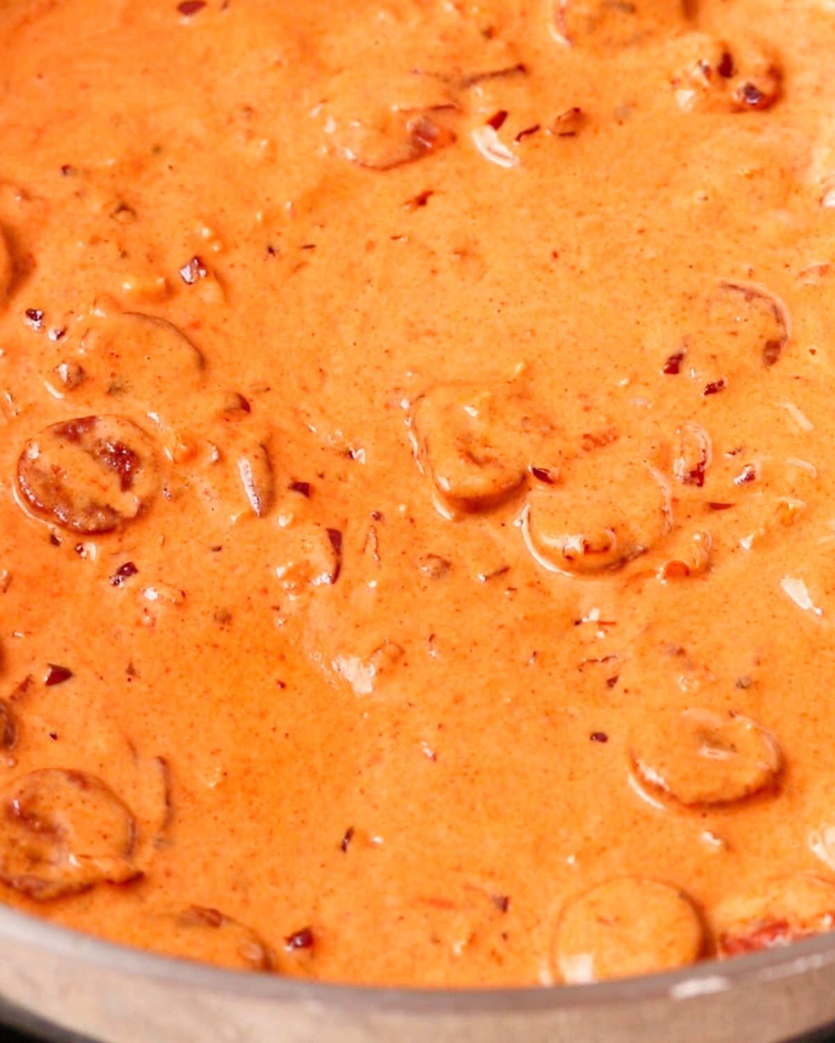 Cream mixed in to create a vibrant orange sauce.