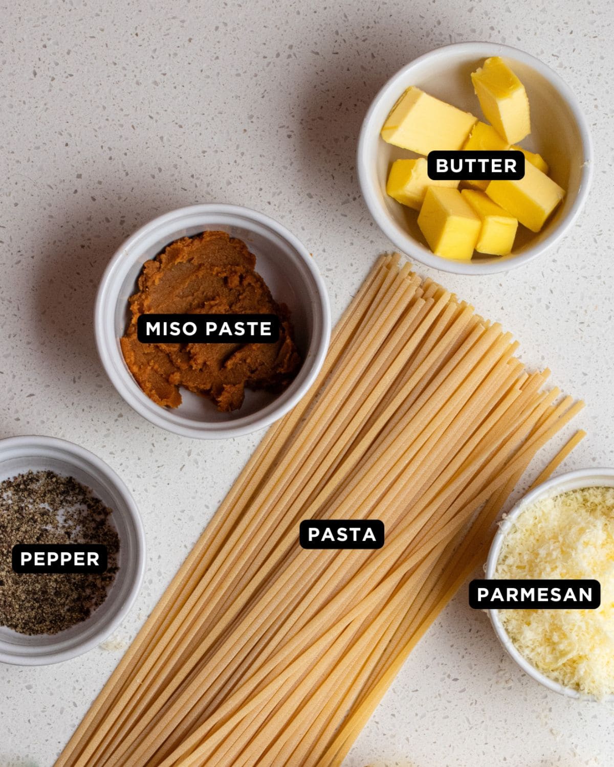 Ingredients on a white bench top.