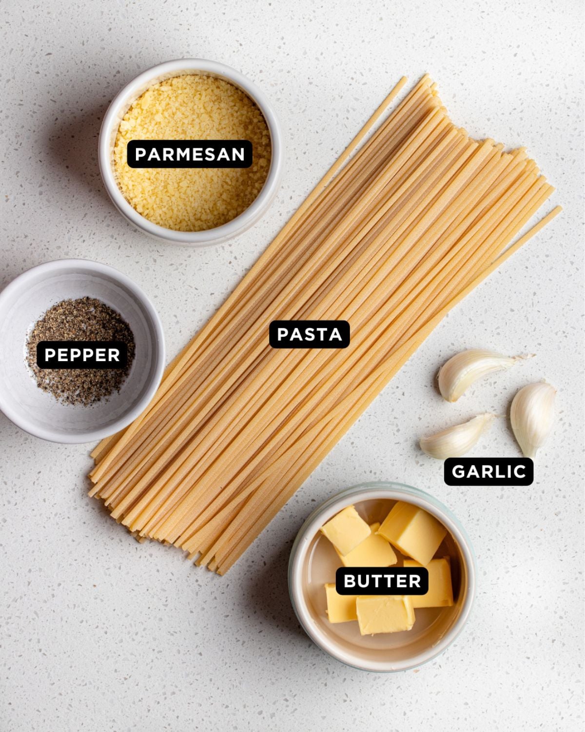 Ingredients on a white bench top.