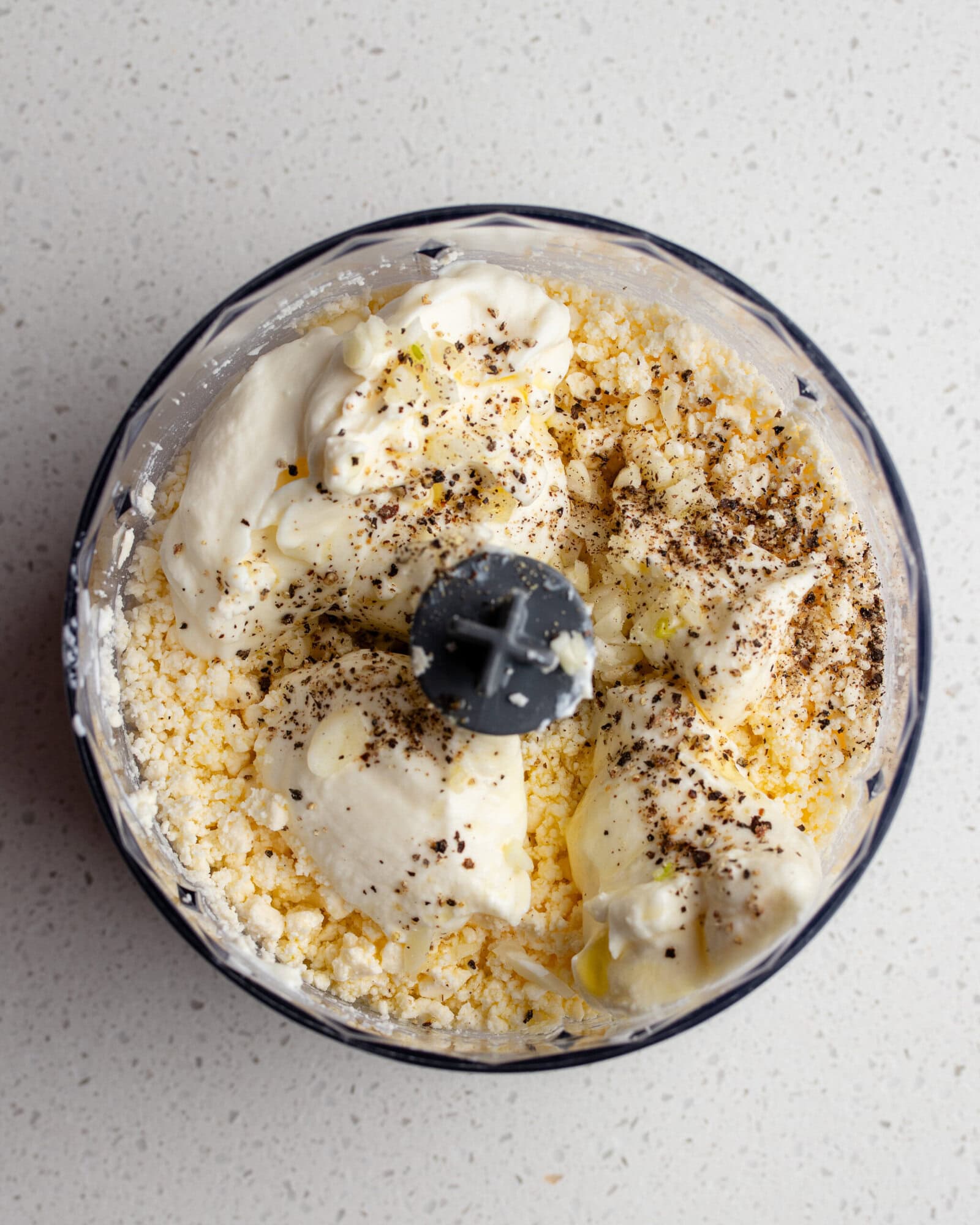 Ingredients added to the feta in food processor.