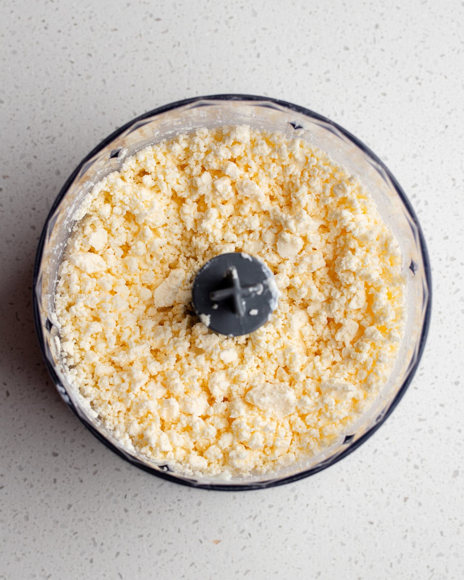 Crumbled feta in a food processor.