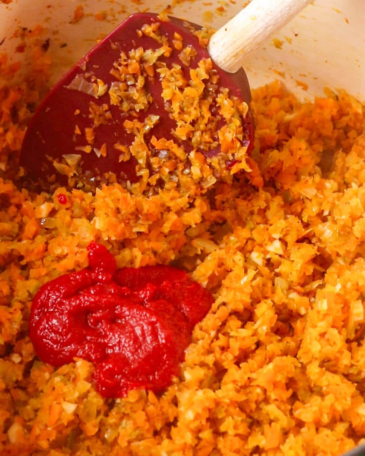 Tomato paste added into the onion mixture.