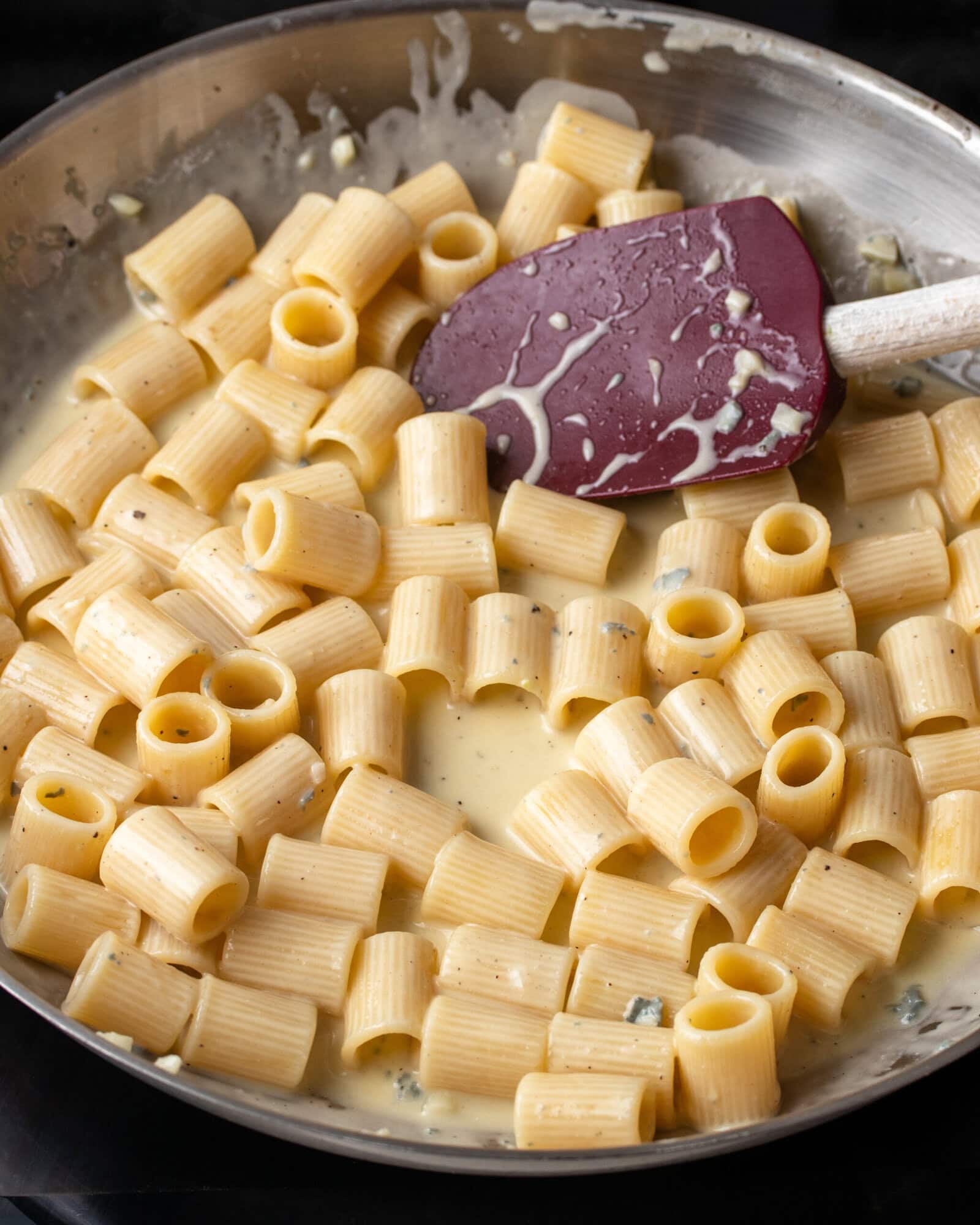Rigatoni tossed in a creamy gorgonzola sauce with pasta water until glossy and well coated.