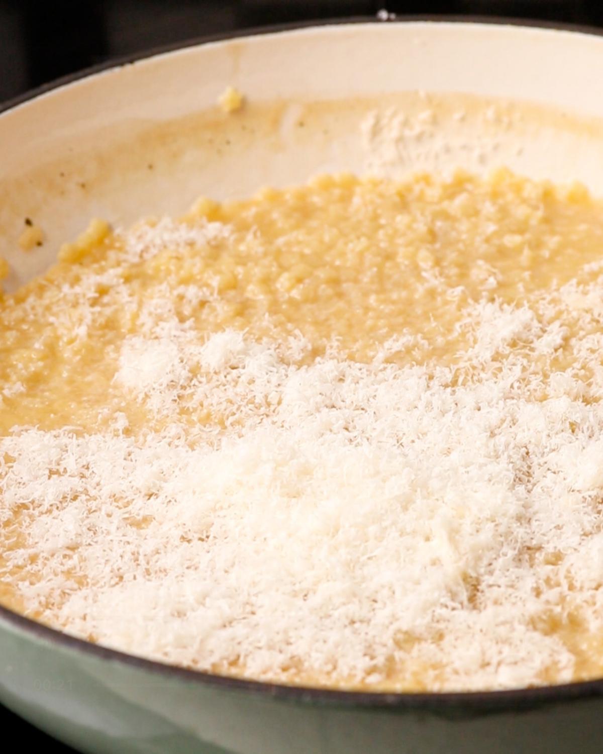 Finely grated parmesan cheese added to buttery cooked pastina.